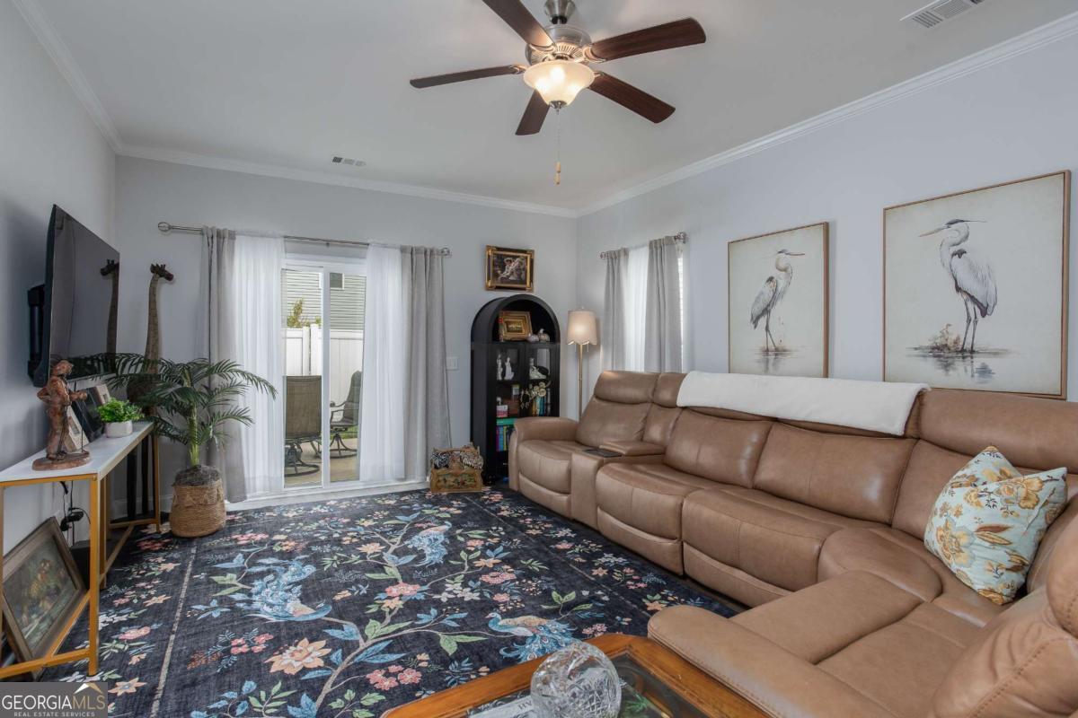 439 Gov Treutlen Circle Pooler, GA 31322 - Photo 7 of 21 a living room with furniture and a window
