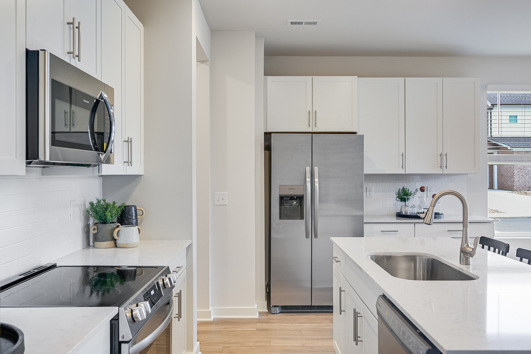 514 Lydia Ashley Lane Smyrna, TN 37167 - Photo 12 of 28 a kitchen with stainless steel appliances granite countertop a sink a refrigerator and a granite counter tops