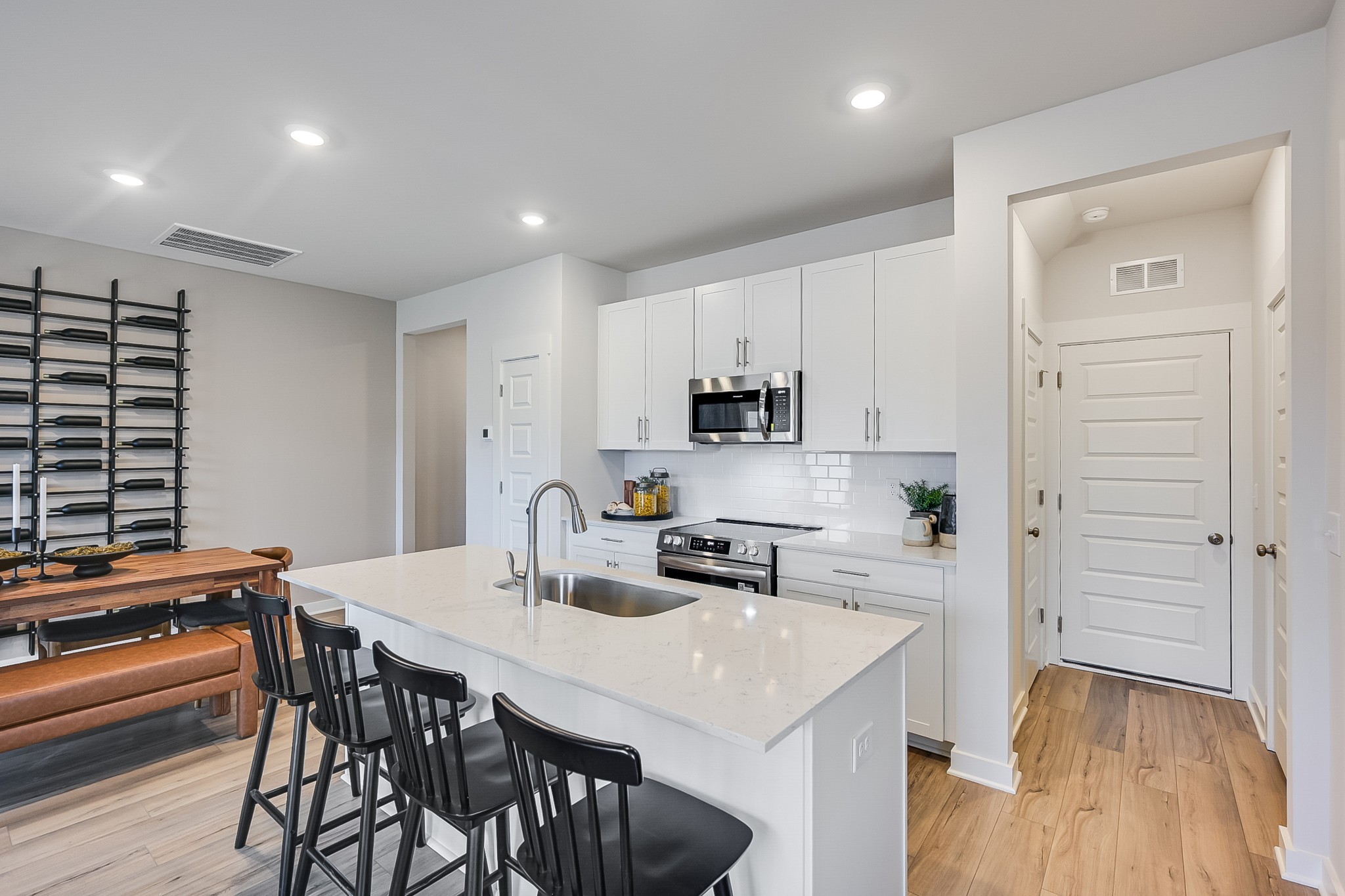514 Lydia Ashley Lane Smyrna, TN 37167 - Photo 13 of 28 a kitchen with stainless steel appliances a sink a stove a table and chairs