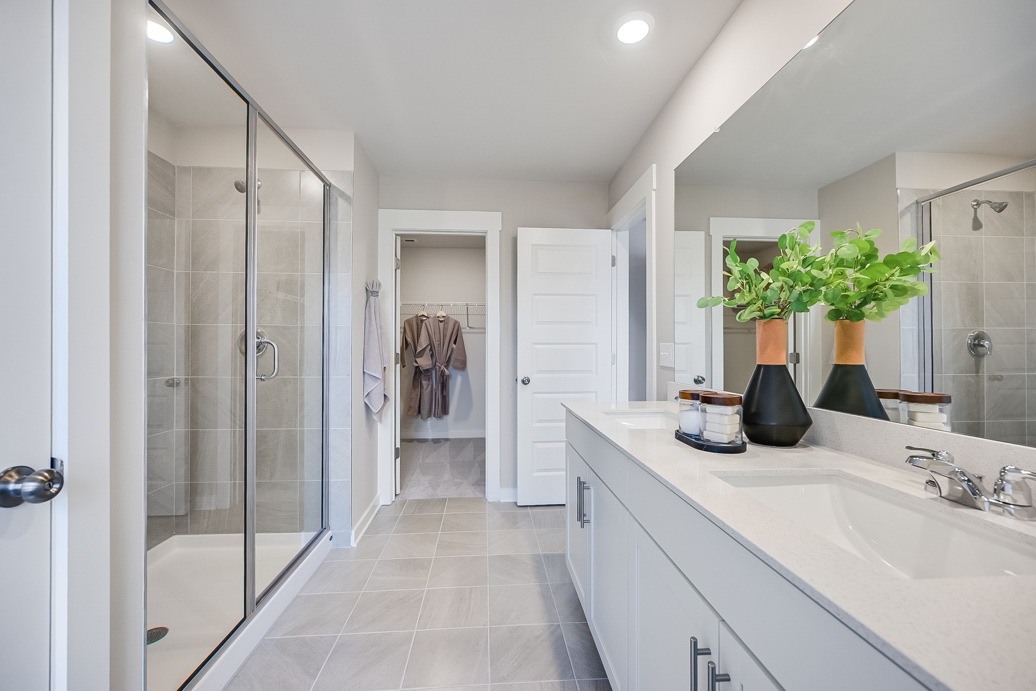 514 Lydia Ashley Lane Smyrna, TN 37167 - Photo 20 of 28 a bathroom with a granite countertop sink a mirror and shower