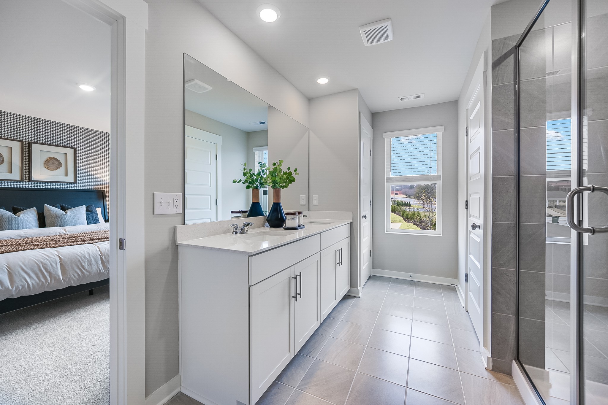 514 Lydia Ashley Lane Smyrna, TN 37167 - Photo 21 of 28 a bathroom with a double vanity sink and a mirror