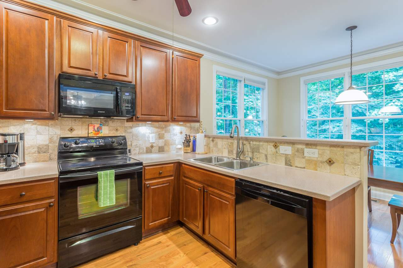 346 Rock Spring Road Wake Forest, NC 27587 - Photo 12 of 24 To the right is an enormous island with cabinets below.