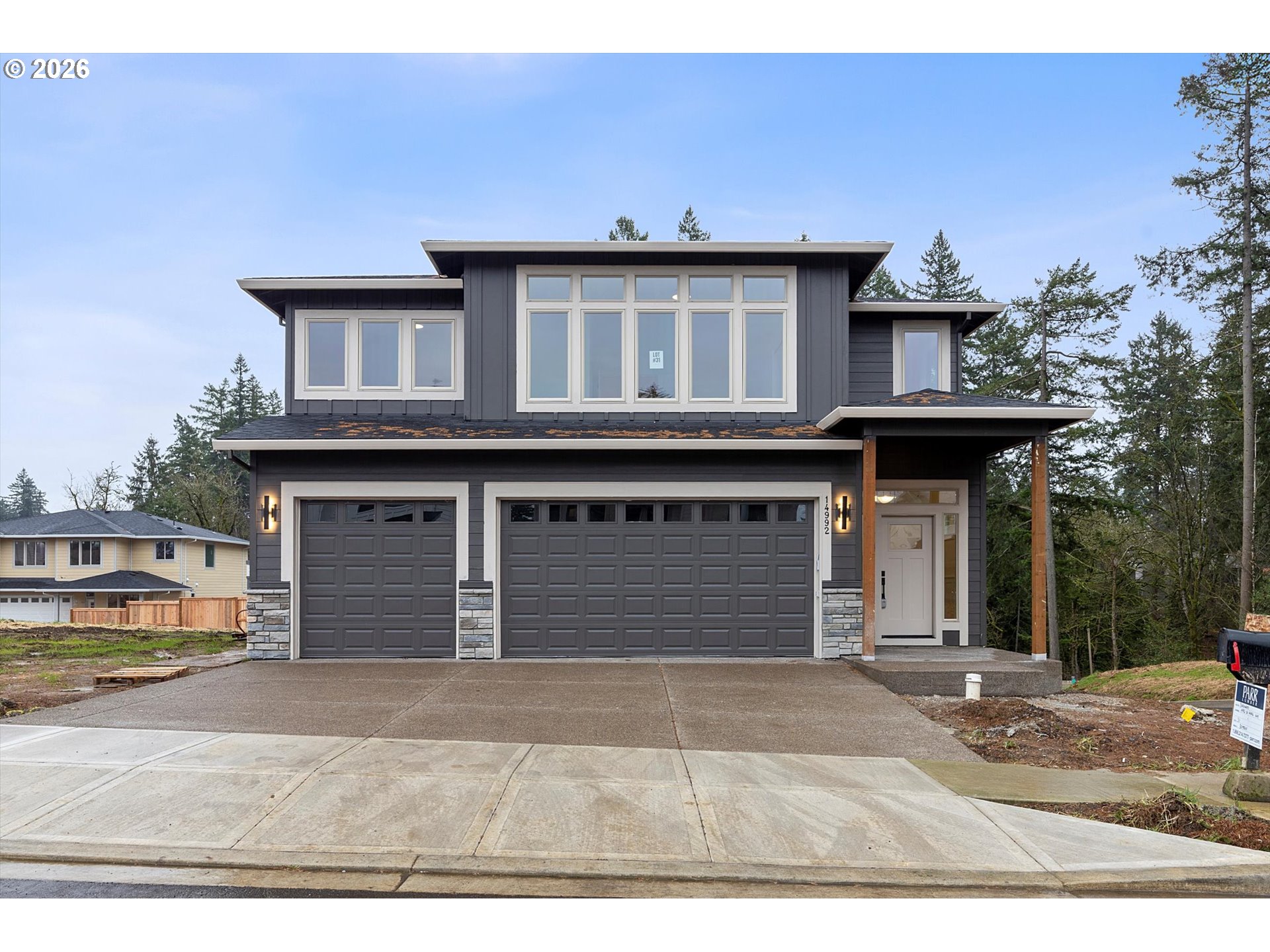 14992 Southeast Andre Way Clackamas, OR 97015 - Photo 1 of 42 a front view of a house with parking