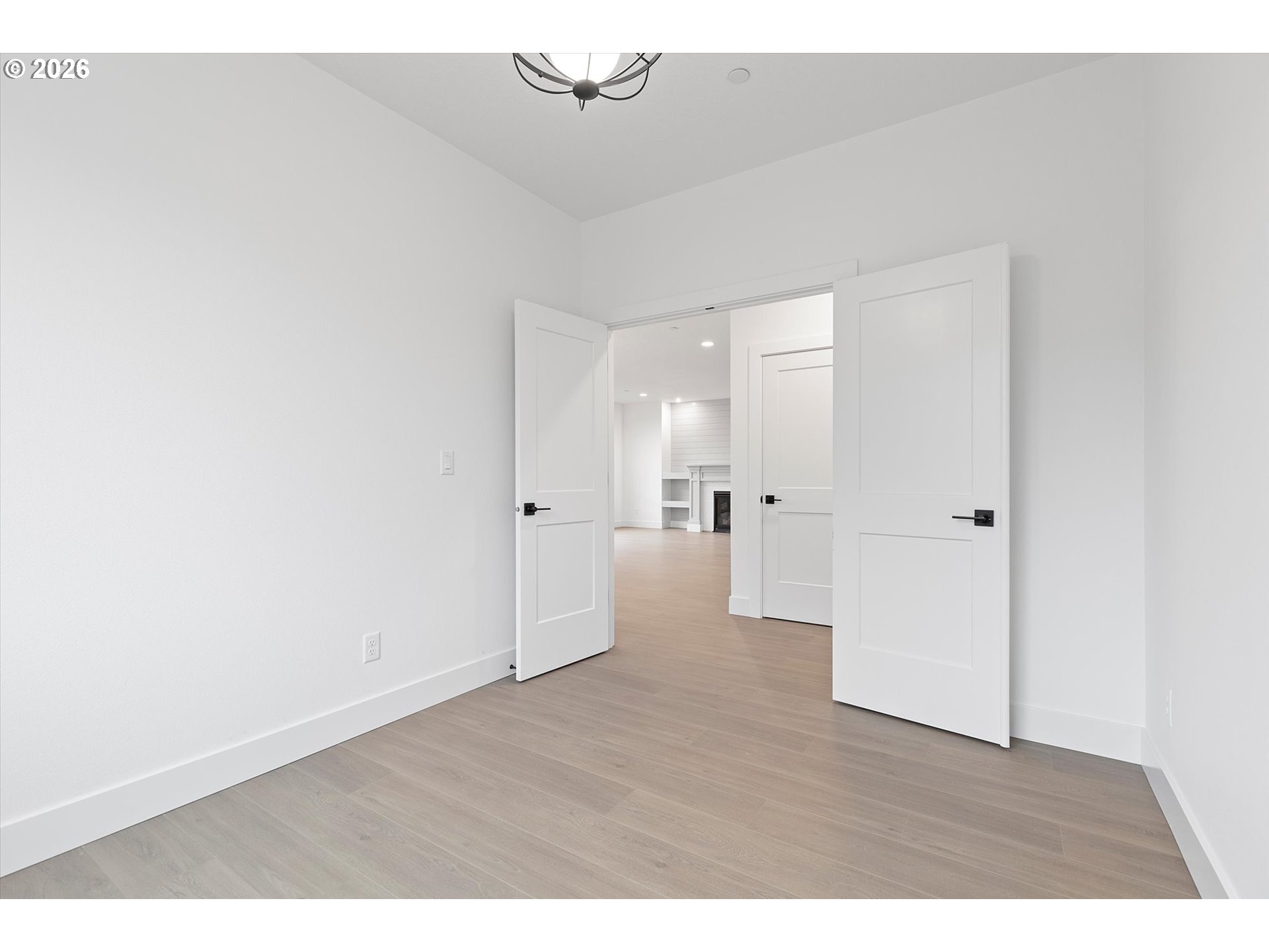 14992 Southeast Andre Way Clackamas, OR 97015 - Photo 17 of 42 a view of a big room with wooden floor and windows