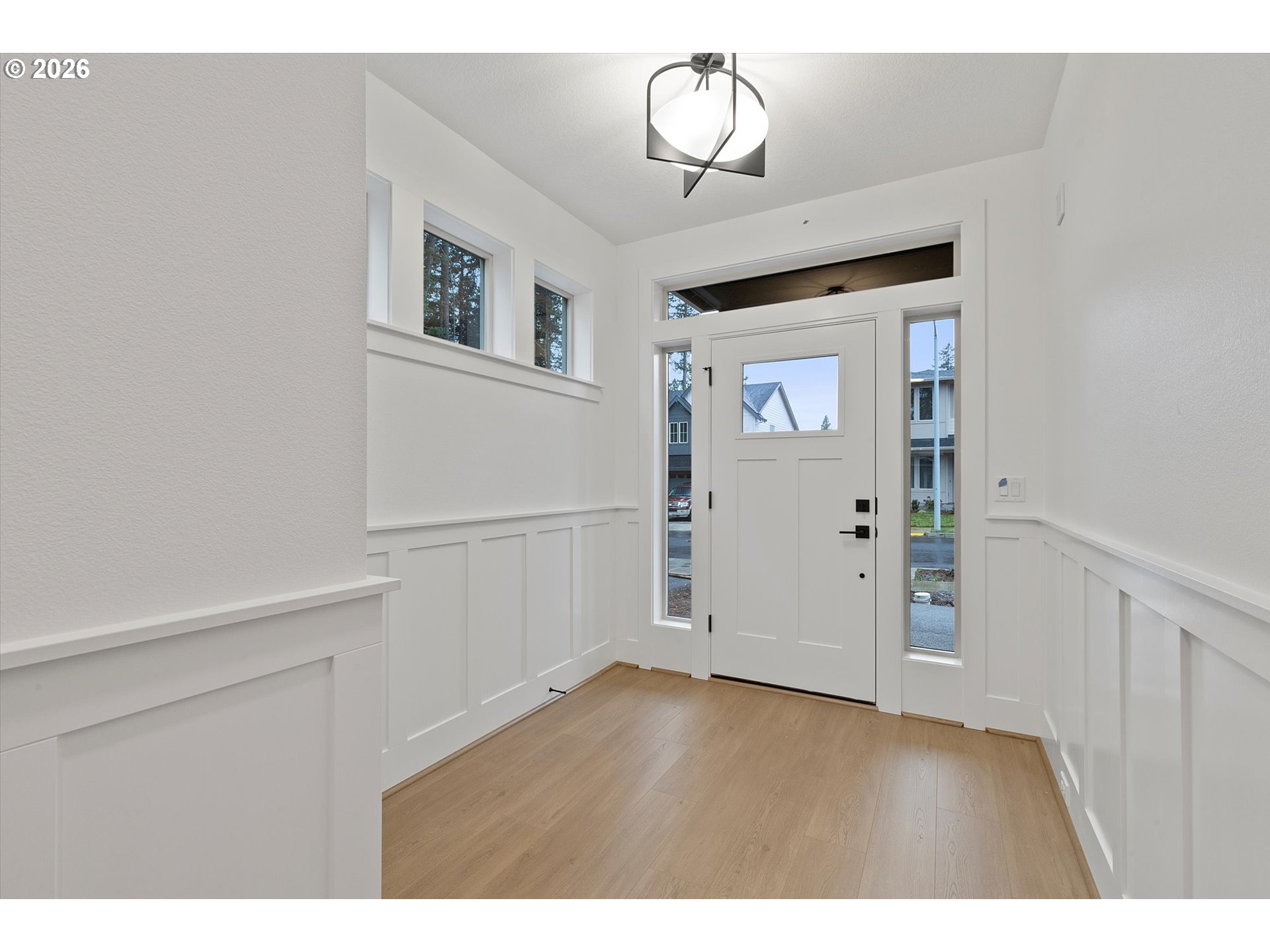 14992 Southeast Andre Way Clackamas, OR 97015 - Photo 2 of 42 a view of empty room with wooden floor