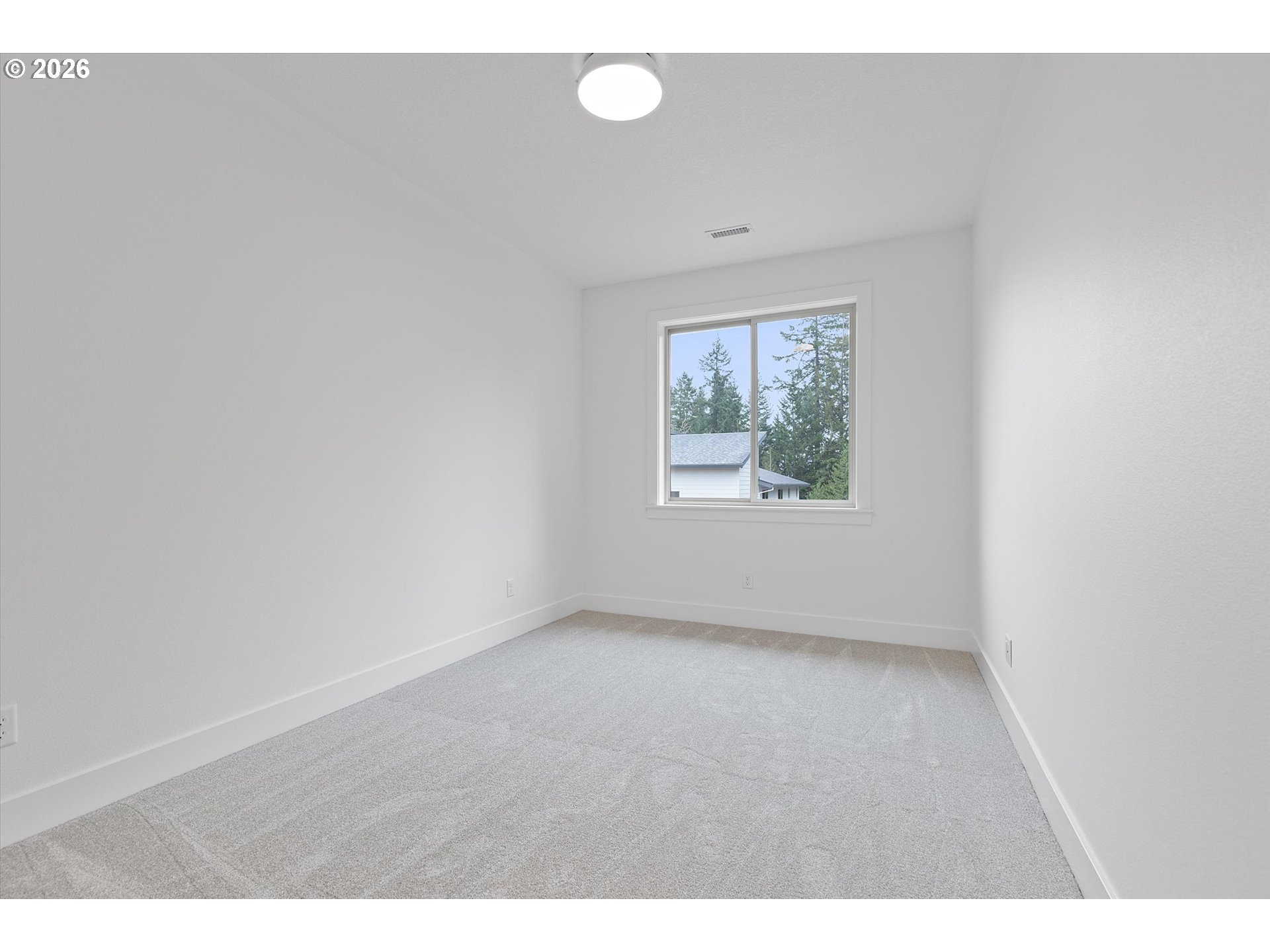 14992 Southeast Andre Way Clackamas, OR 97015 - Photo 21 of 42 a view of an empty room with a window