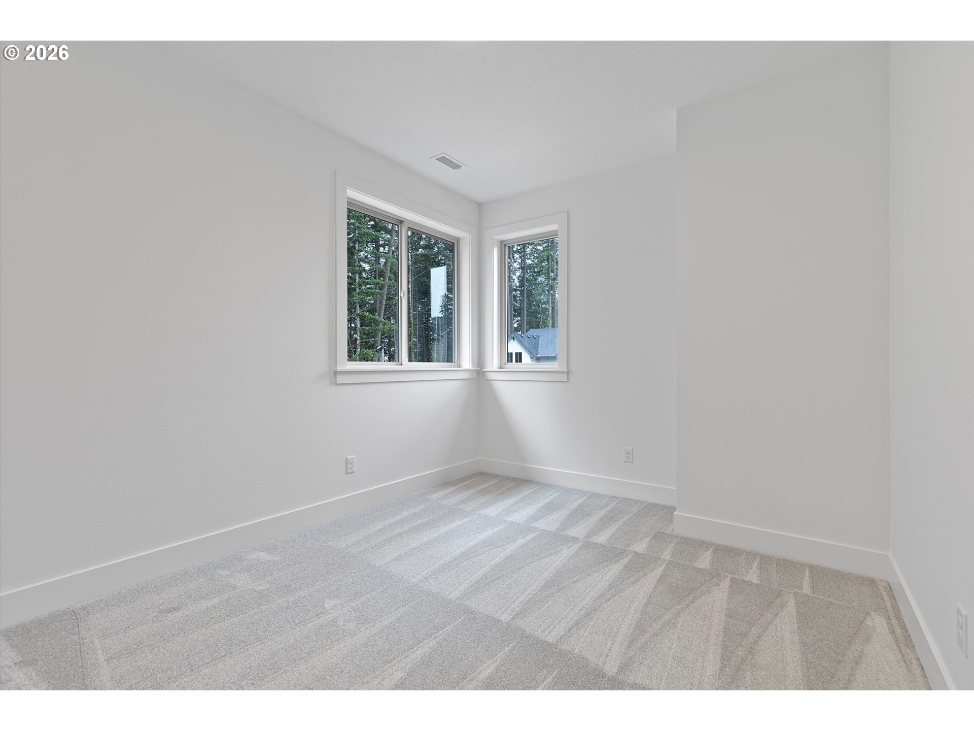 14992 Southeast Andre Way Clackamas, OR 97015 - Photo 30 of 42 a view of an empty room with wooden floor and windows