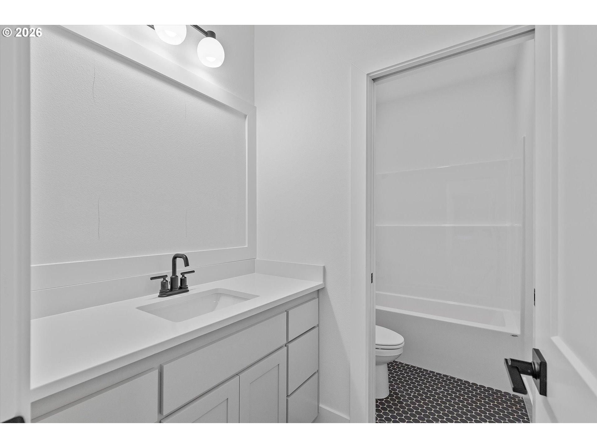 14992 Southeast Andre Way Clackamas, OR 97015 - Photo 35 of 42 a bathroom with a sink a toilet and shower