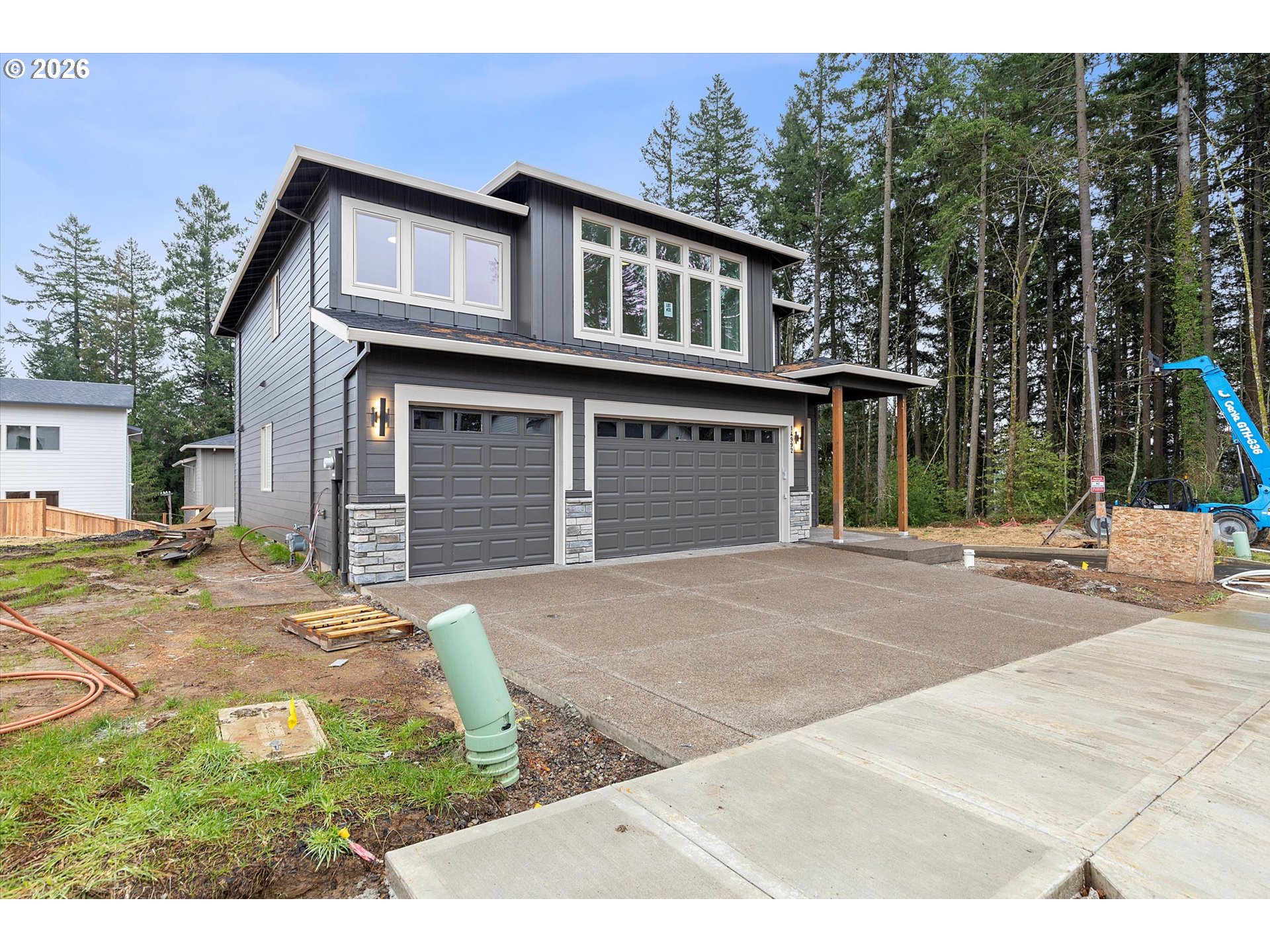 14992 Southeast Andre Way Clackamas, OR 97015 - Photo 42 of 42 a front view of a house with a garden