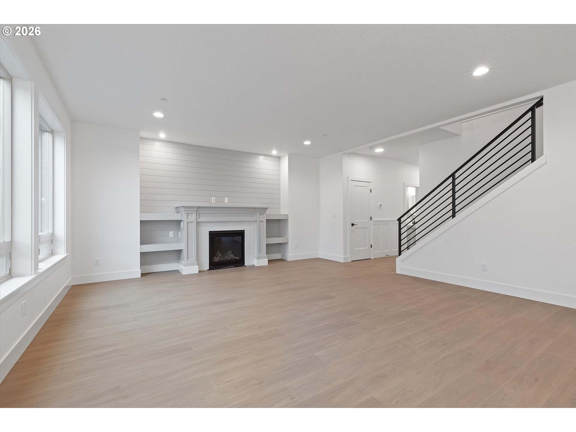 14992 Southeast Andre Way Clackamas, OR 97015 - Photo 6 of 42 a view of an empty room with a fireplace and a window