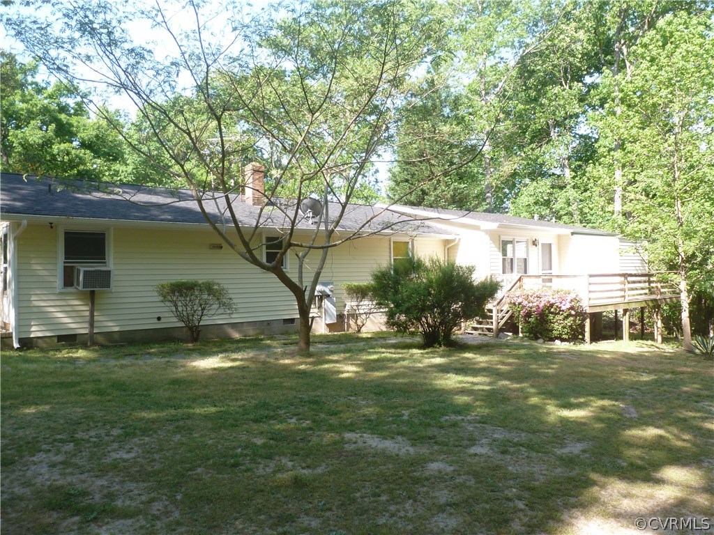 18078 Old Ridge Road Montpelier, VA 23192 - Photo 4 of 9 a backyard of a house with table and chairs