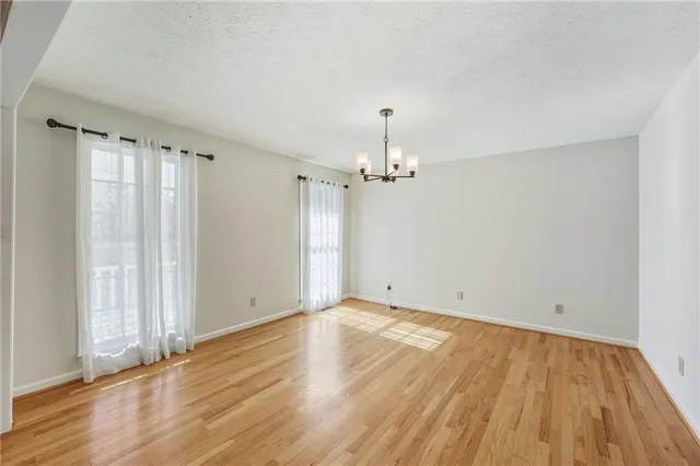 a view of a kitchen with furniture wooden floor and a kitchen