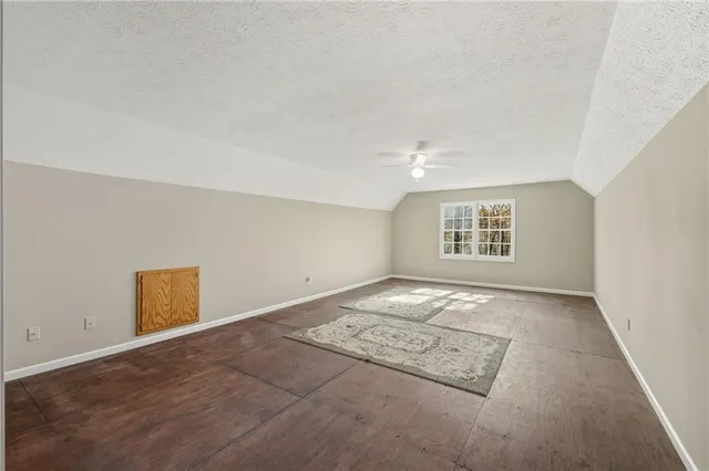 a view of porch with a table and chairs