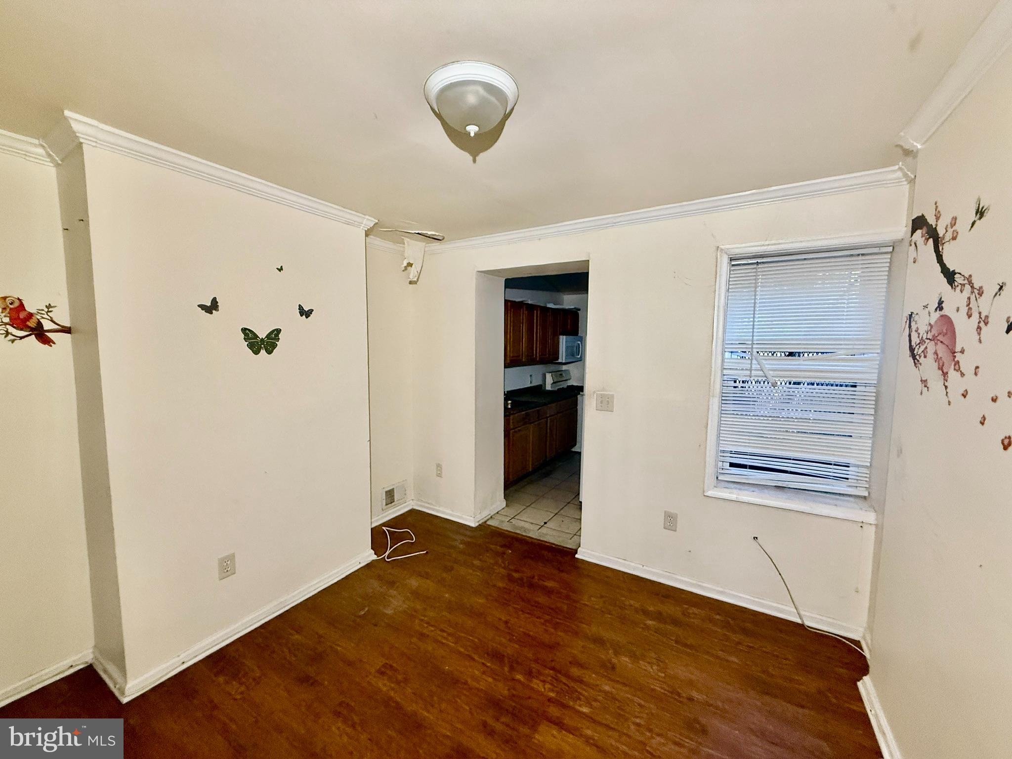 340 South Calhoun Street Baltimore, MD 21223 - Photo 4 of 15 wooden floor in an empty room