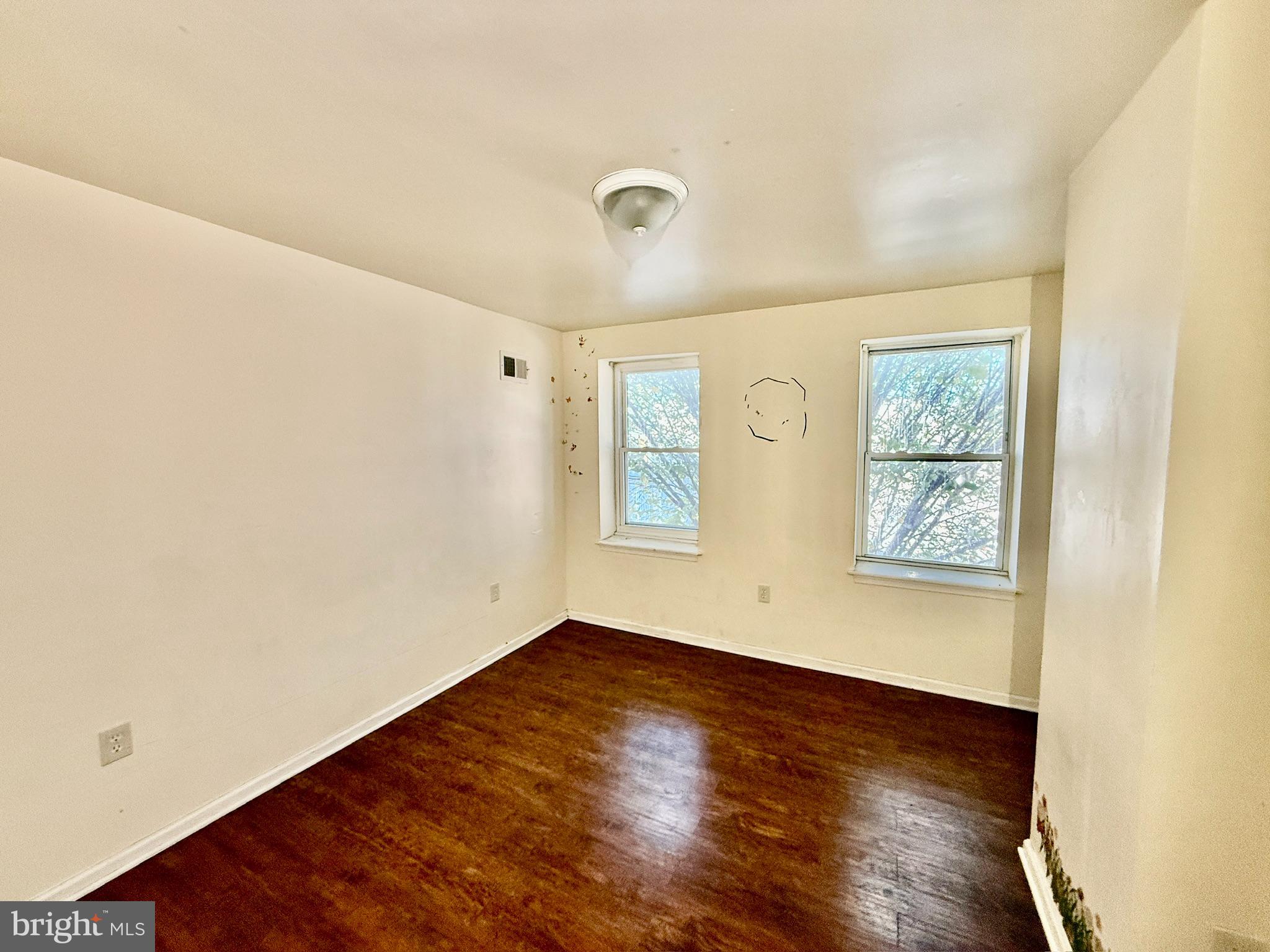 340 South Calhoun Street Baltimore, MD 21223 - Photo 8 of 15 a view of a room with wooden floor and window