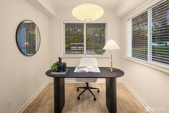 a view of a room that has a table and a chair