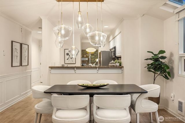 a kitchen with a table and chairs in it