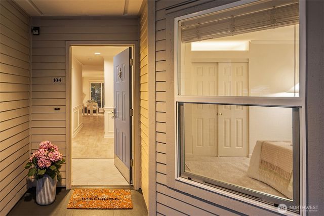a view of a two chairs in the balcony