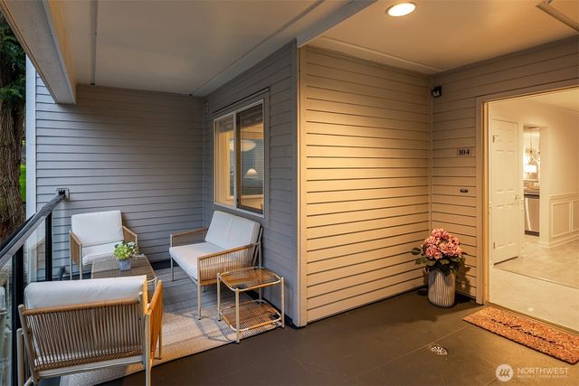a view of a two chairs in the balcony