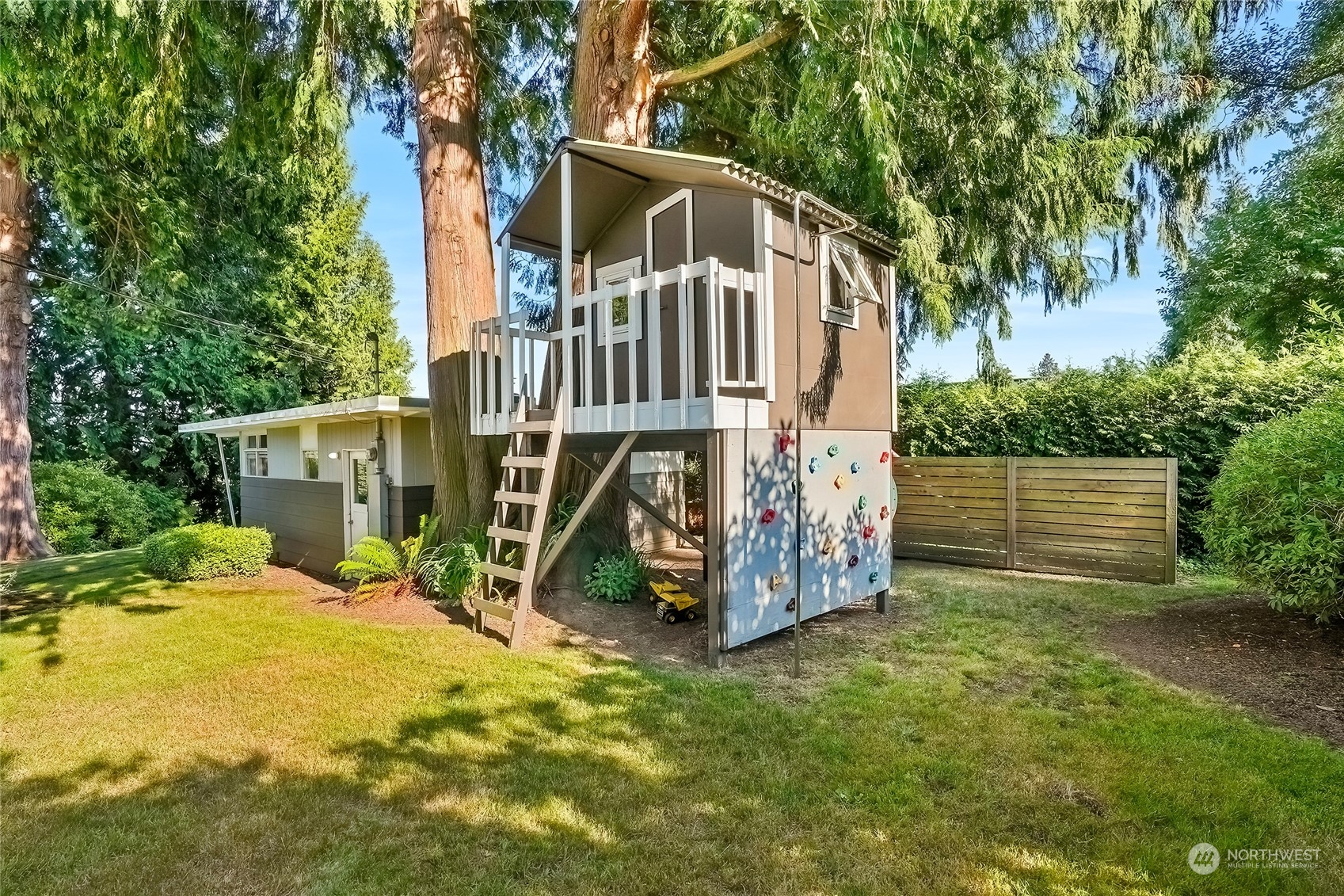 1104 39th Street Everett, WA 98201 - Photo 39 of 40 a view of a small house with wooden fence