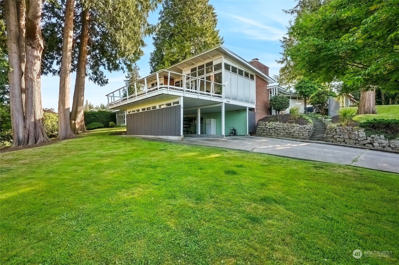 1104 39th Street Everett, WA 98201 - Photo 40 of 40 a front view of a house with a garden and trees