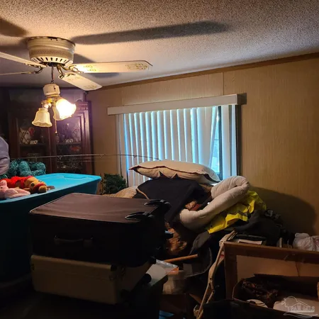 a bed sitting in a room next to a window