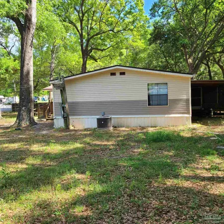 a backyard of a house with lots of green space