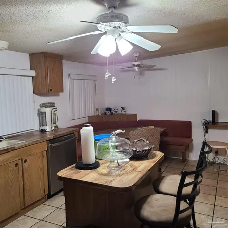 a kitchen with a dining table and chairs
