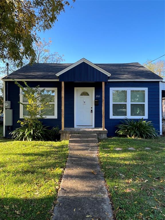 3919 Carl Street Dallas, TX 75210 - Photo 1 of 17 a front view of a house with a yard
