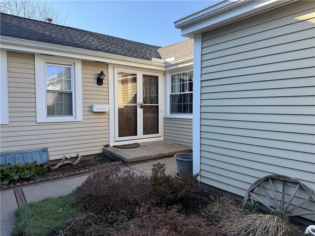 295 Hidden Valley Road Gates, NY 14624 - Photo 2 of 49 Entrance way is tucked around the corner, behind t