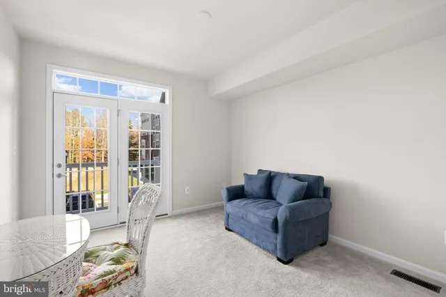 a living room with furniture and windows