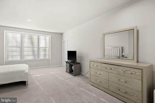 a bedroom with a bed and furniture