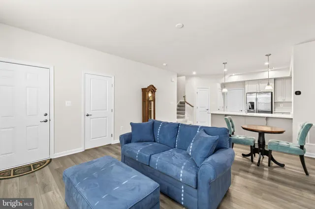 a living room with furniture and a table