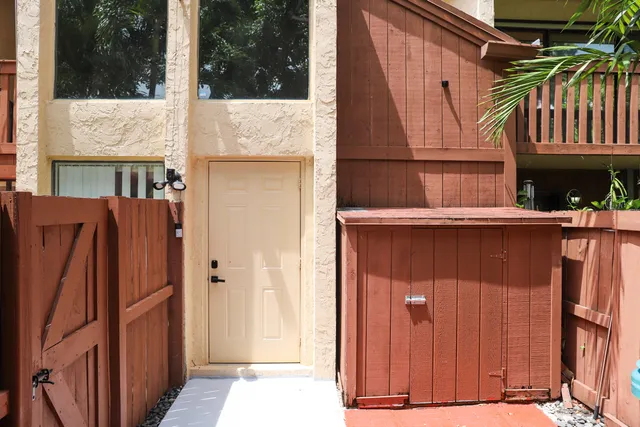a view of a house with a door and a window