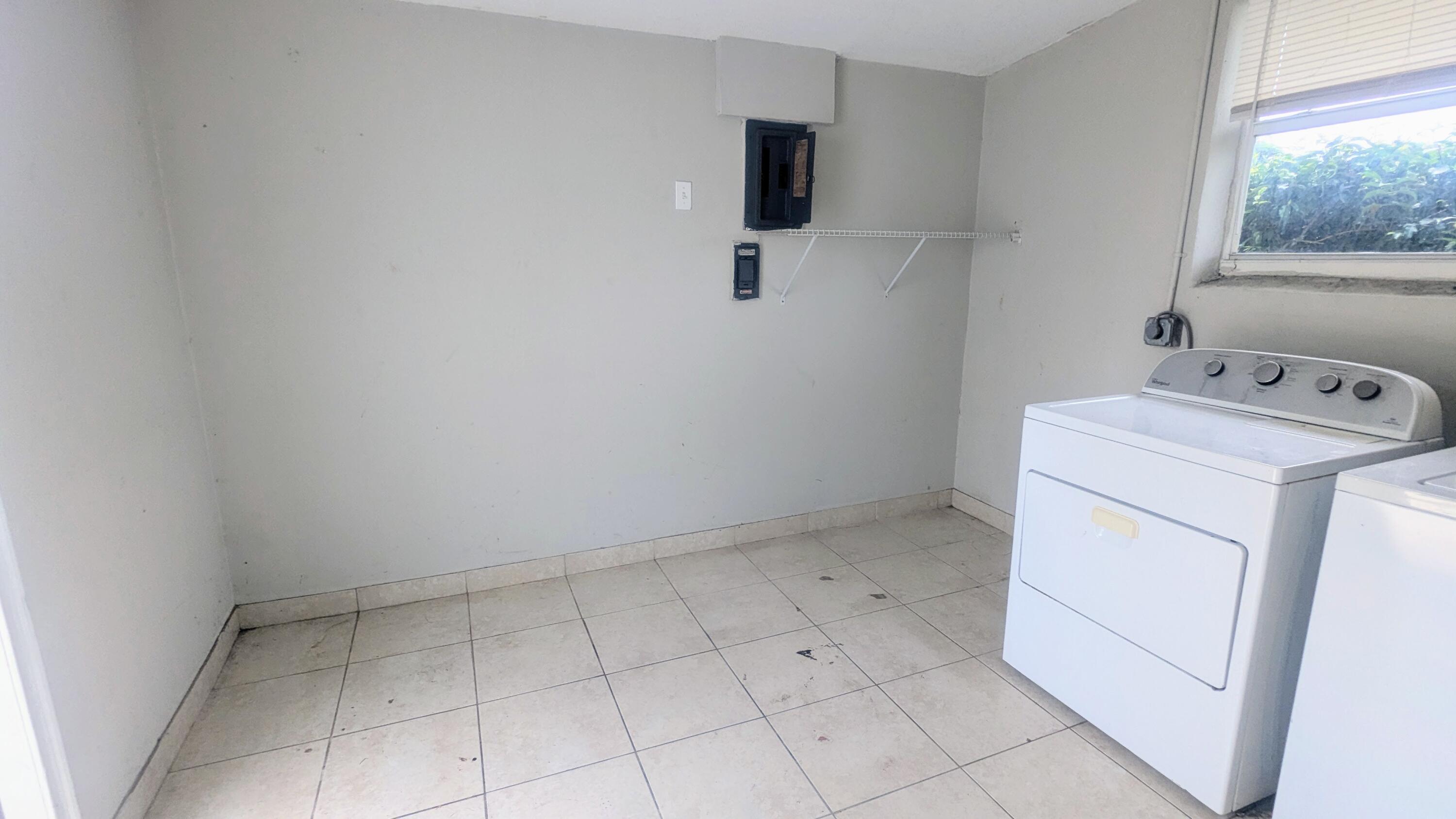 85 Morgans Way Palm Springs, FL 33461 - Photo 11 of 17 a utility room with dryer and washer