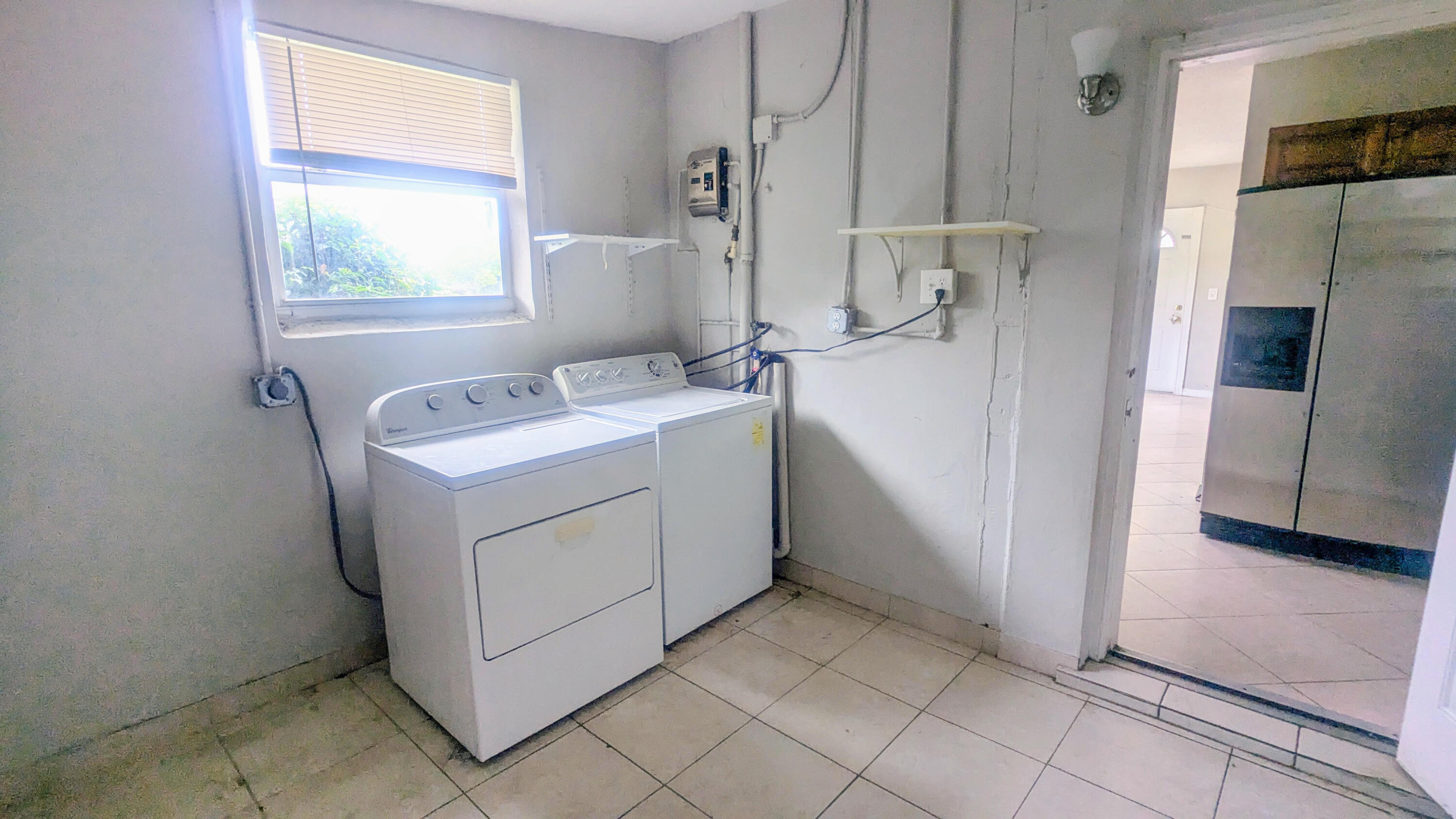 85 Morgans Way Palm Springs, FL 33461 - Photo 13 of 17 a utility room with dryer and washer