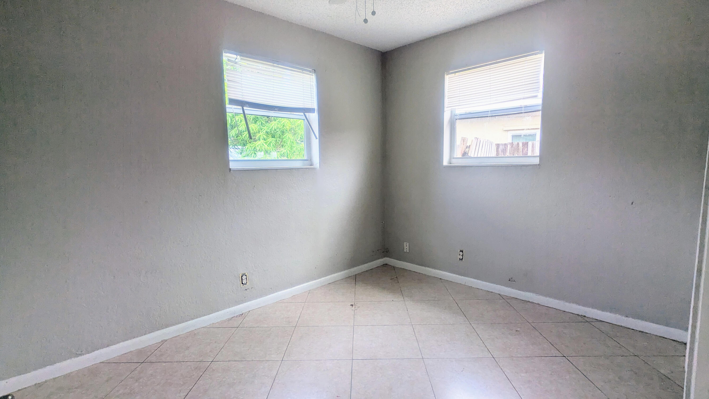85 Morgans Way Palm Springs, FL 33461 - Photo 2 of 17 an empty room with windows