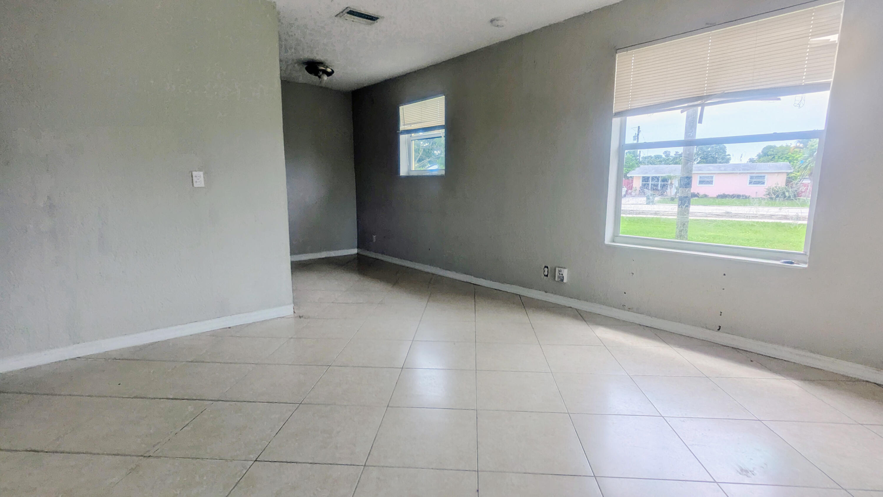 85 Morgans Way Palm Springs, FL 33461 - Photo 8 of 17 an empty room with windows