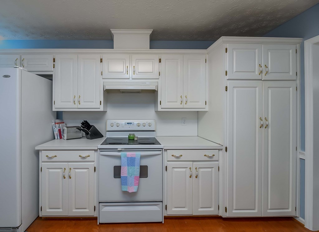 32 Bugle Brook Court Midland, GA 31820 - Photo 12 of 30 a kitchen with white cabinets and appliances