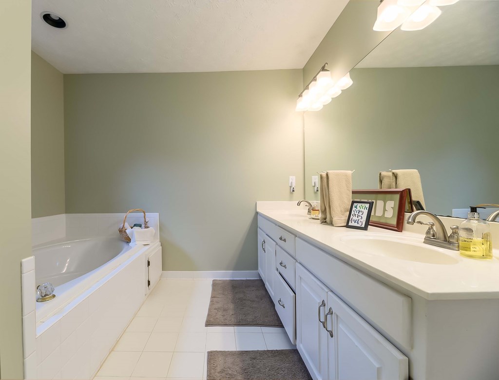 32 Bugle Brook Court Midland, GA 31820 - Photo 17 of 30 a bathroom with a tub sink and mirror