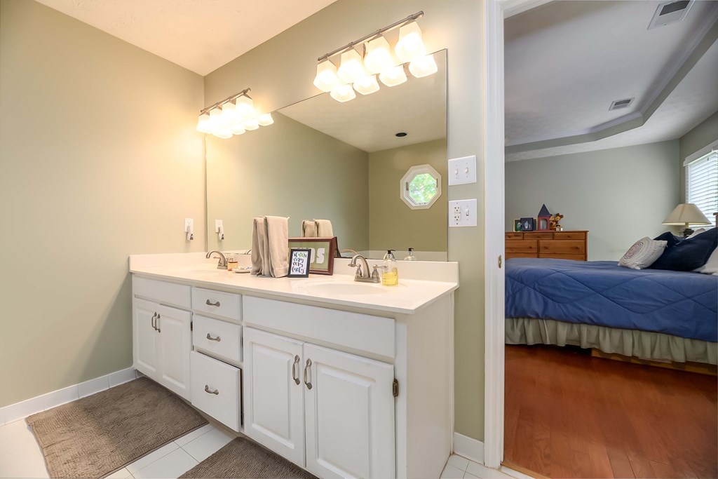 32 Bugle Brook Court Midland, GA 31820 - Photo 18 of 30 a en suite bathroom with a double vanity sink and a mirror