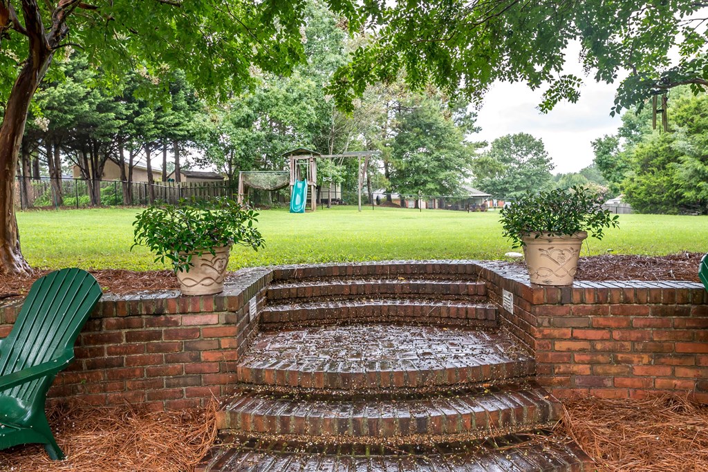 32 Bugle Brook Court Midland, GA 31820 - Photo 26 of 30 a view of garden with patio