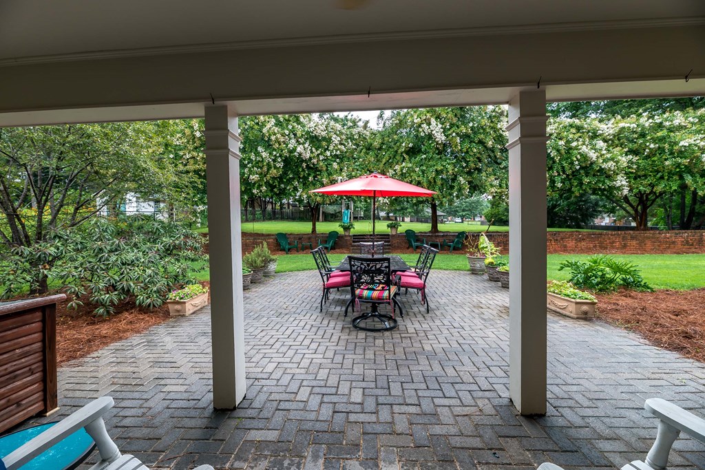 32 Bugle Brook Court Midland, GA 31820 - Photo 7 of 30 a view of a patio with a dining table chairs and a small yard
