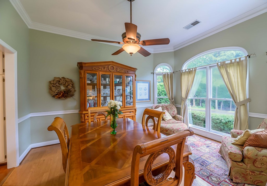 32 Bugle Brook Court Midland, GA 31820 - Photo 8 of 30 a dining room with furniture a chandelier and window
