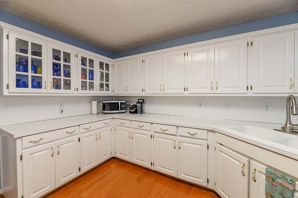 32 Bugle Brook Court Midland, GA 31820 - Photo 10 of 30 a kitchen with stainless steel appliances granite countertop white cabinets and a sink