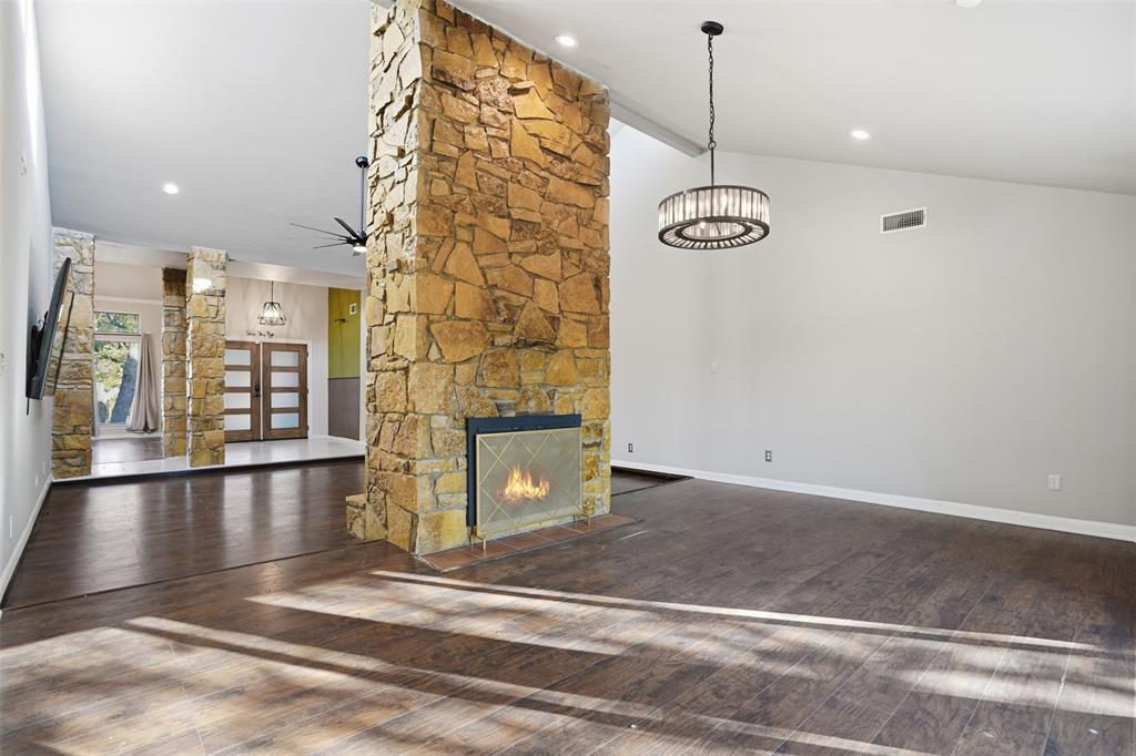 704 Timberview Court North Fort Worth, TX 76112 - Photo 13 of 40 a view of a room with a chandelier
