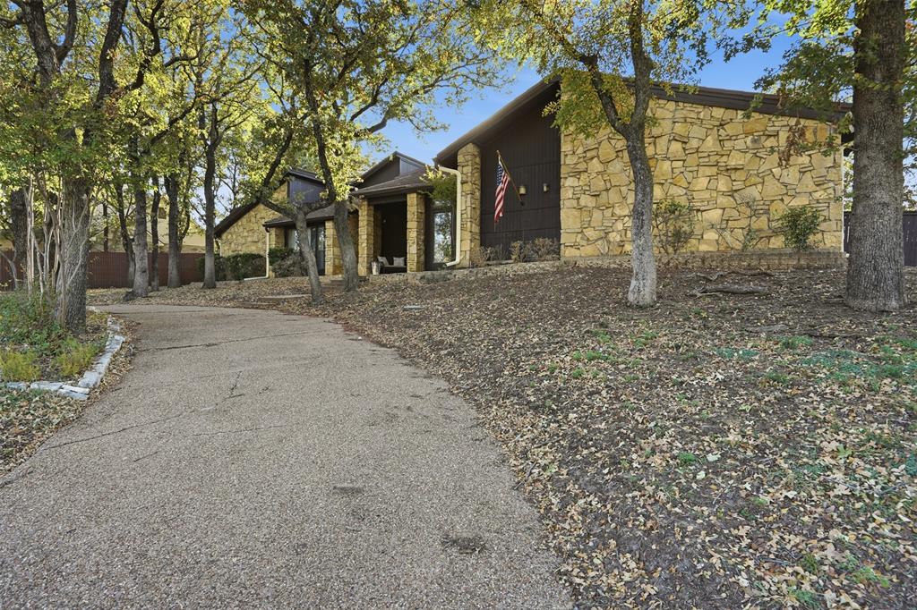 704 Timberview Court North Fort Worth, TX 76112 - Photo 2 of 40 front view of a house with a tiny play house
