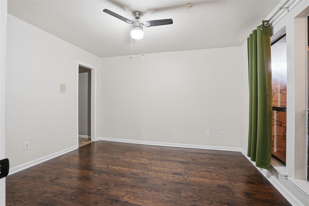 704 Timberview Court North Fort Worth, TX 76112 - Photo 27 of 40 wooden floor in an empty room