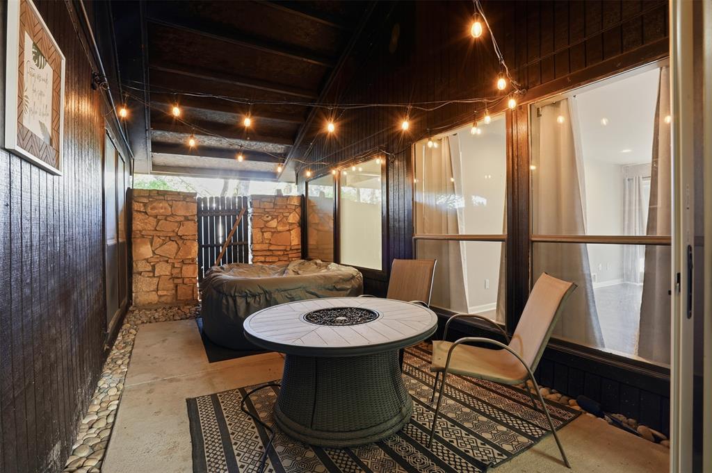 704 Timberview Court North Fort Worth, TX 76112 - Photo 32 of 40 a view of a dining room with furniture window and wooden floor