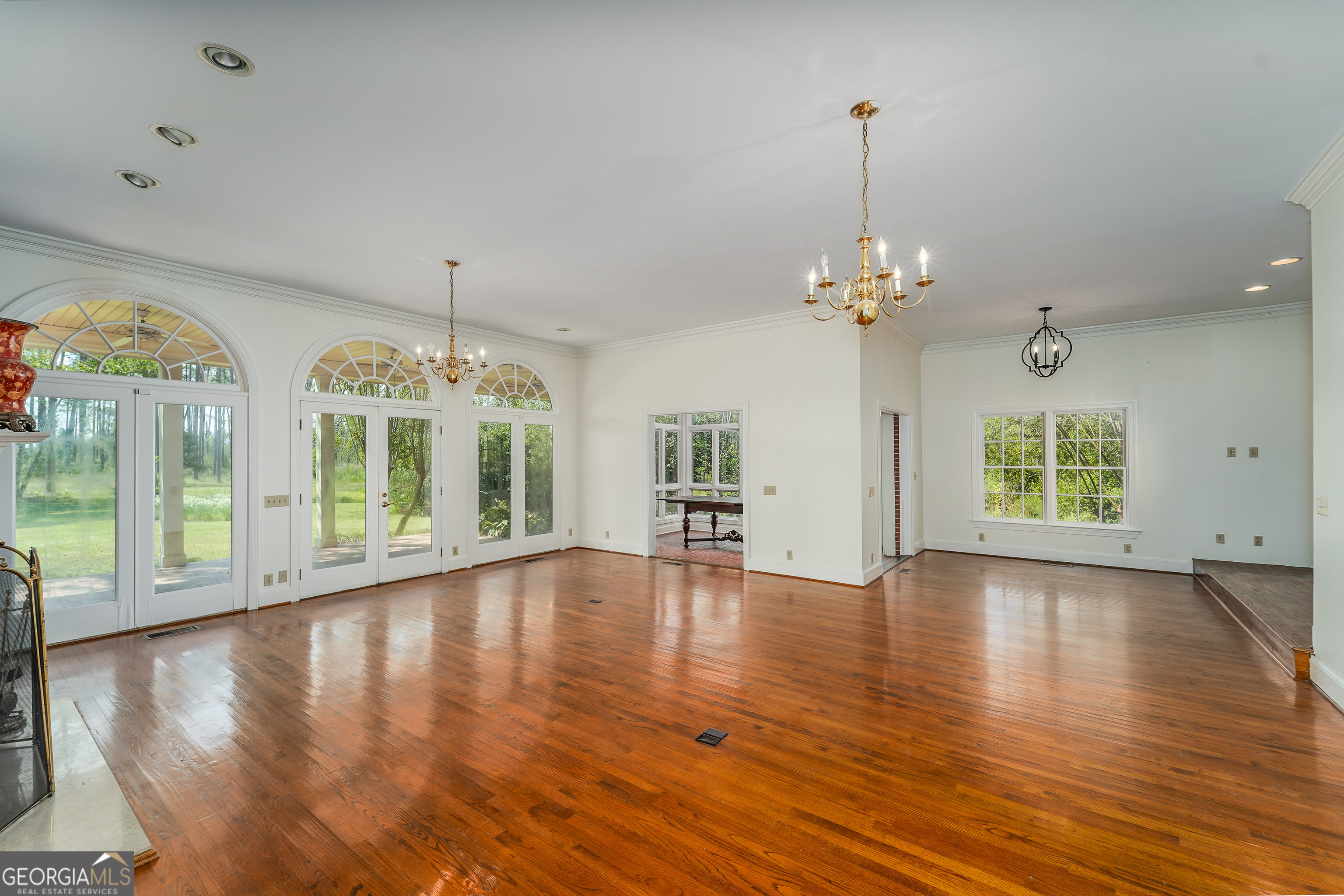 1602 Ward St Extension West Douglas, GA 31533 - Photo 31 of 70 a view of an empty room with wooden floor and a window